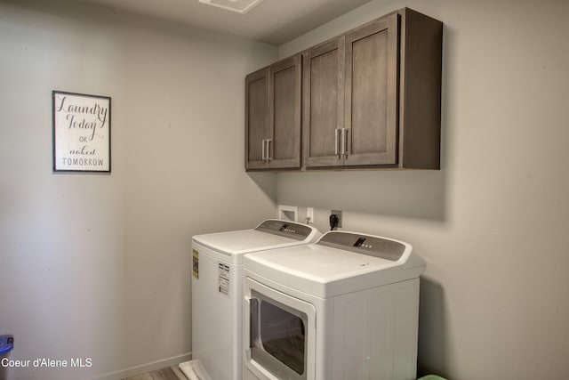 1733 N Minam Loop, Post Falls, ID 83854 - clothes washing area with cabinet space and washer and clothes dryer