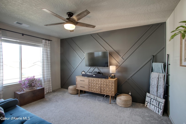 1733 N Minam Loop, Post Falls, ID 83854 - interior space featuring visible vents, ceiling fan, a textured ceiling, and a decorative wall