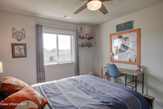 1733 N Minam Loop, Post Falls, ID 83854 - bedroom featuring a ceiling fan, visible vents, a textured ceiling, and carpet floors