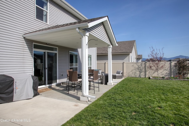 1733 N Minam Loop, Post Falls, ID 83854 - view of patio / terrace featuring a grill, fence, and an outdoor hangout area