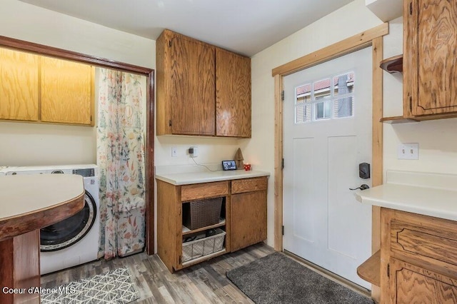 820 Plum Ln, Saint Maries, ID 83861 - laundry room with cabinet space, washer / clothes dryer, and wood finished floors