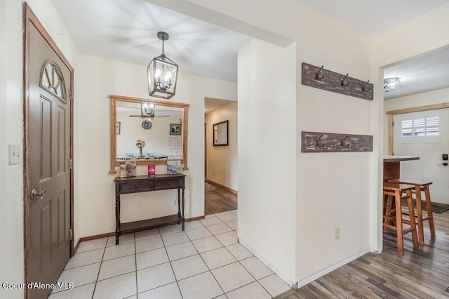 820 Plum Ln, Saint Maries, ID 83861 - foyer with an inviting chandelier, baseboards, and light wood finished floors