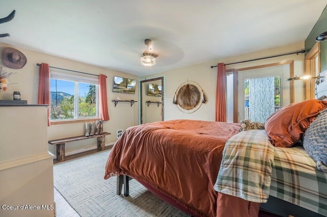 820 Plum Ln, Saint Maries, ID 83861 - bedroom with a ceiling fan, baseboards, and multiple windows