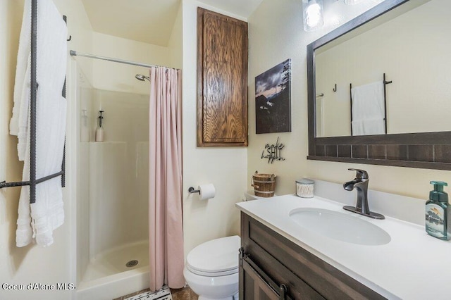 820 Plum Ln, Saint Maries, ID 83861 - full bathroom featuring vanity, a stall shower, and toilet