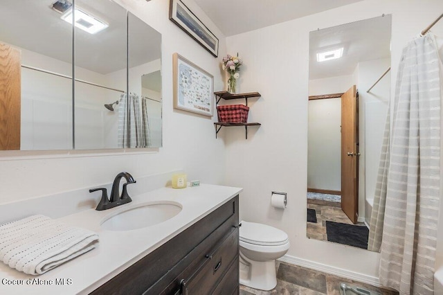 820 Plum Ln, Saint Maries, ID 83861 - full bath featuring vanity, curtained shower, and toilet