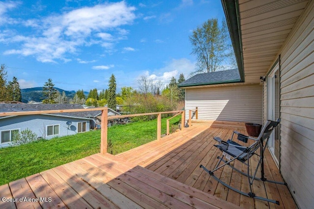 820 Plum Ln, Saint Maries, ID 83861 - wooden deck with a mountain view and a yard