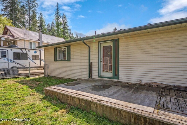 820 Plum Ln, Saint Maries, ID 83861 - rear view of property with a lawn and fence