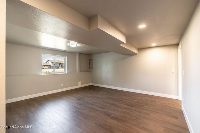 unfurnished room with baseboards, recessed lighting, and wood finished floors