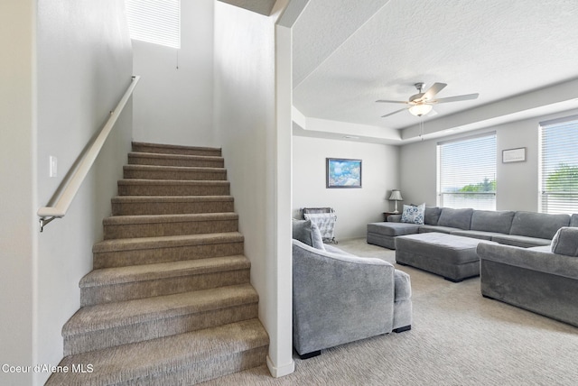 1622 N Minam Loop, Post Falls, ID 83854 - staircase featuring carpet, a ceiling fan, and a textured ceiling