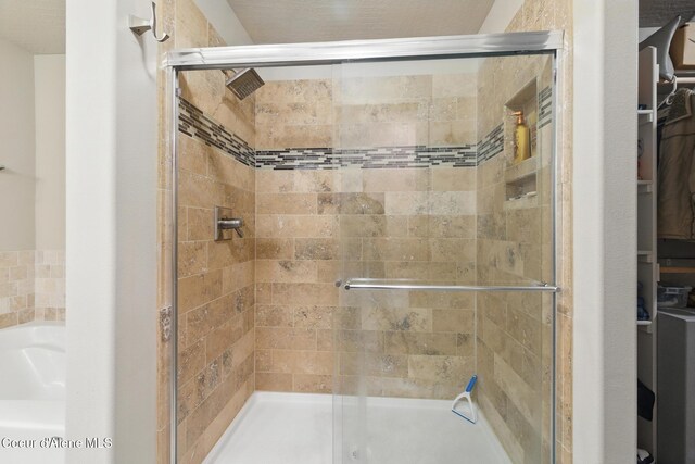 1622 N Minam Loop, Post Falls, ID 83854 - bathroom featuring a shower stall and a spacious closet