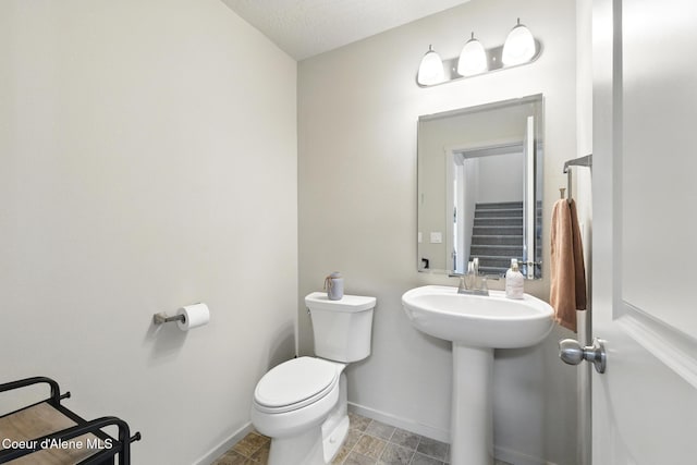 1622 N Minam Loop, Post Falls, ID 83854 - bathroom featuring toilet and baseboards