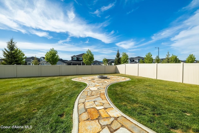 1622 N Minam Loop, Post Falls, ID 83854 - view of yard with a residential view, an outdoor fire pit, and a patio area