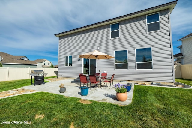 1622 N Minam Loop, Post Falls, ID 83854 - rear view of house featuring a patio