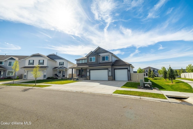 1622 N Minam Loop, Post Falls, ID 83854 - view of front of house with driveway, an attached garage, stone siding, and a residential view