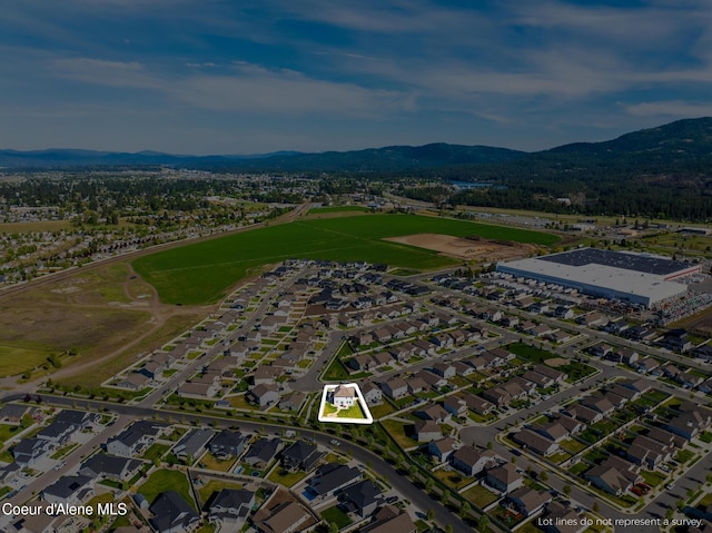 1622 N Minam Loop, Post Falls, ID 83854 - aerial view of property and surrounding area featuring a mountain backdrop and nearby suburban area