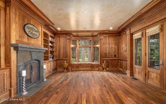 7566 E Gem Shores Rd, Hayden, ID 83835 - unfurnished living room with crown molding, wood finished floors, and wooden walls