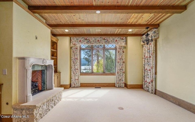 7566 E Gem Shores Rd, Hayden, ID 83835 - unfurnished living room with carpet flooring, a fireplace with raised hearth, beamed ceiling, and wooden ceiling
