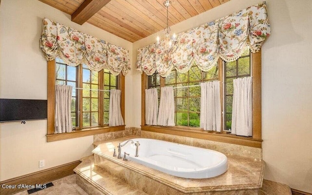7566 E Gem Shores Rd, Hayden, ID 83835 - bathroom with wood ceiling, a bath, a wealth of natural light, and beamed ceiling