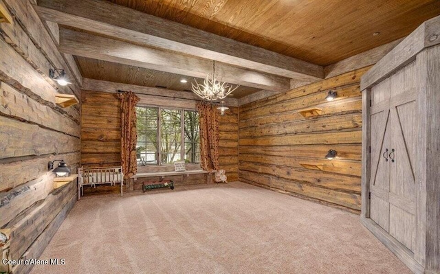 7566 E Gem Shores Rd, Hayden, ID 83835 - unfurnished room with carpet flooring, an inviting chandelier, wooden ceiling, and log walls