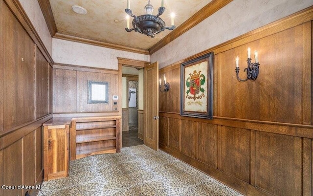 7566 E Gem Shores Rd, Hayden, ID 83835 - hall featuring wooden walls, a chandelier, and ornamental molding