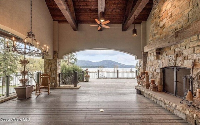 7566 E Gem Shores Rd, Hayden, ID 83835 - deck with a ceiling fan, a mountain view, and a gate