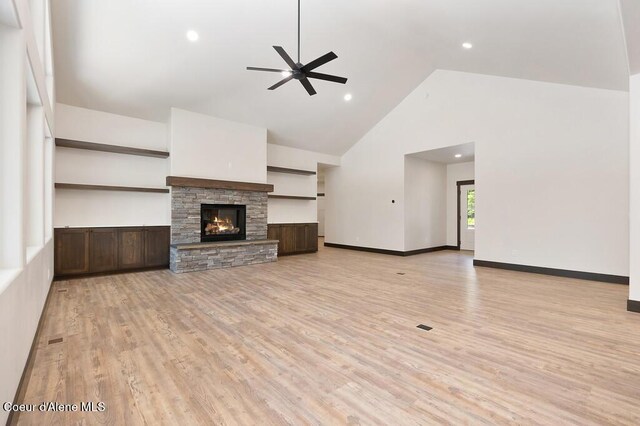 unfurnished living room featuring high vaulted ceiling, a ceiling fan, recessed lighting, and light wood-style flooring