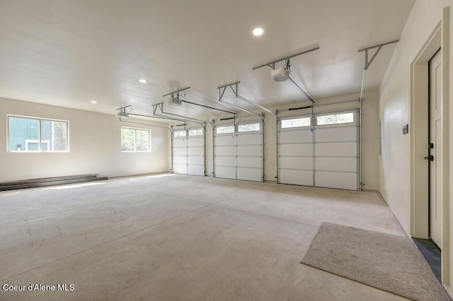 garage featuring recessed lighting and a garage door opener