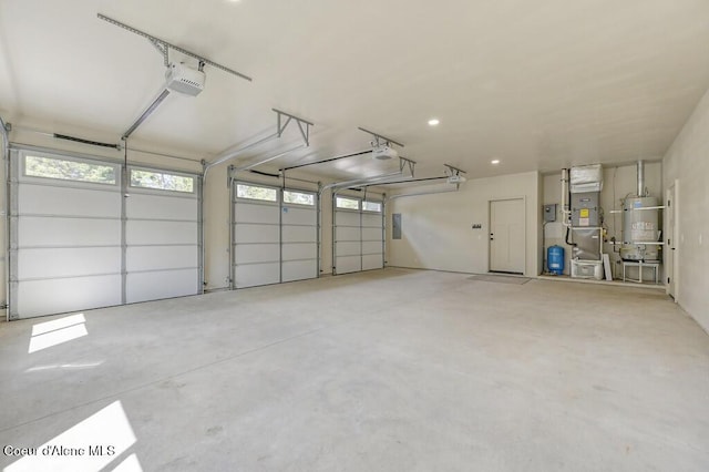 garage featuring heating unit, secured water heater, a garage door opener, and electric panel