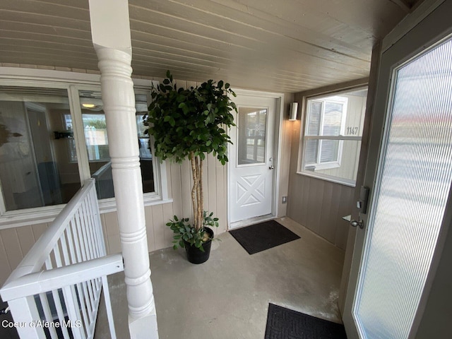 view of exterior entry with board and batten siding