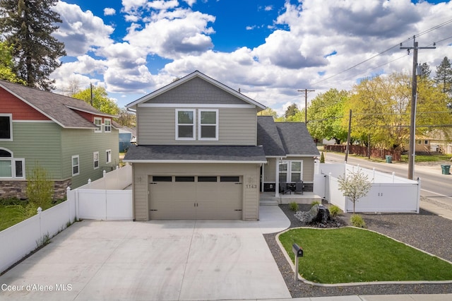 craftsman-style home with fence, driveway, roof with shingles, and a garage