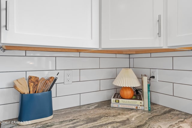 details featuring white cabinetry