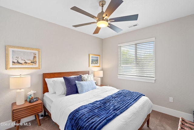 bedroom with visible vents, carpet flooring, baseboards, and ceiling fan