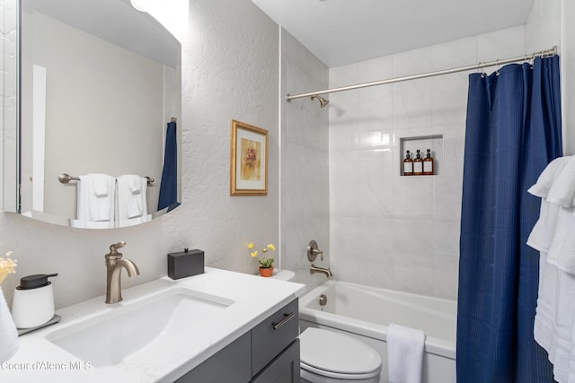 full bathroom with shower / tub combo, a textured wall, toilet, and vanity