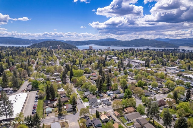bird's eye view with a residential view and a water and mountain view