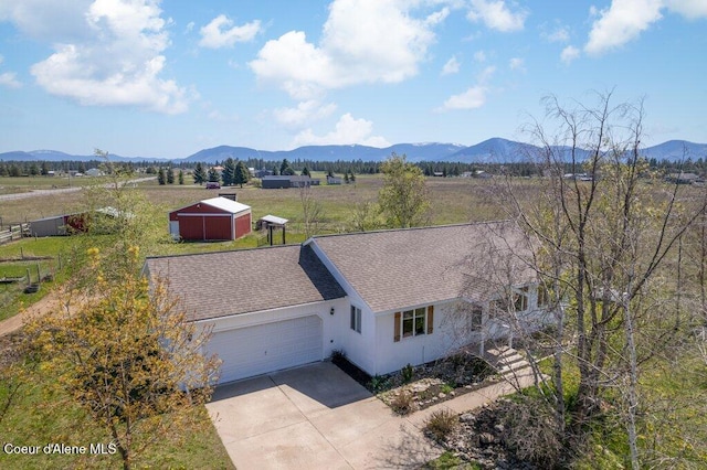 bird's eye view featuring a mountain view and a rural view