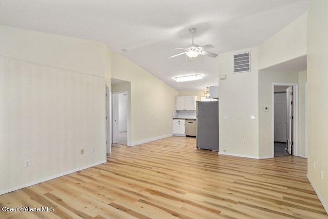 unfurnished living room featuring visible vents, baseboards, a ceiling fan, light wood finished floors, and vaulted ceiling