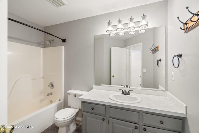 full bath with toilet, visible vents, tub / shower combination, and vanity
