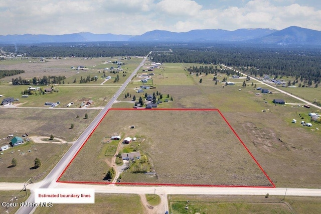 aerial view featuring a mountain view and a rural view