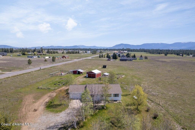 birds eye view of property featuring a mountain view and a rural view