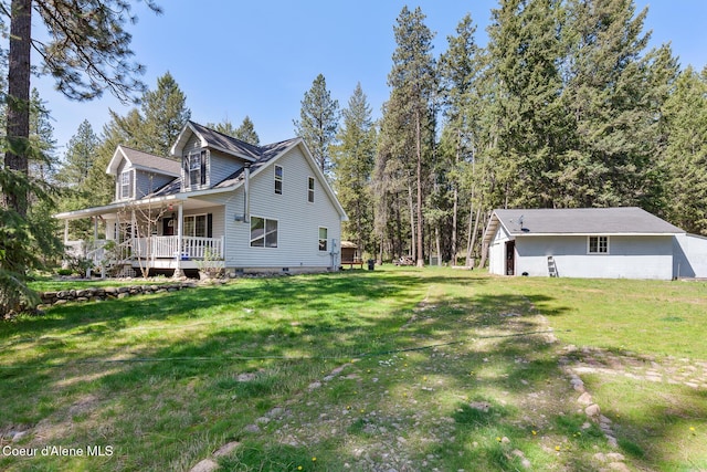 130 Stone Haven Dr, Blanchard, ID 83804 - view of home's exterior with a porch and a yard