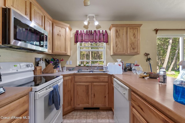 130 Stone Haven Dr, Blanchard, ID 83804 - kitchen featuring a sink, light countertops, and white appliances