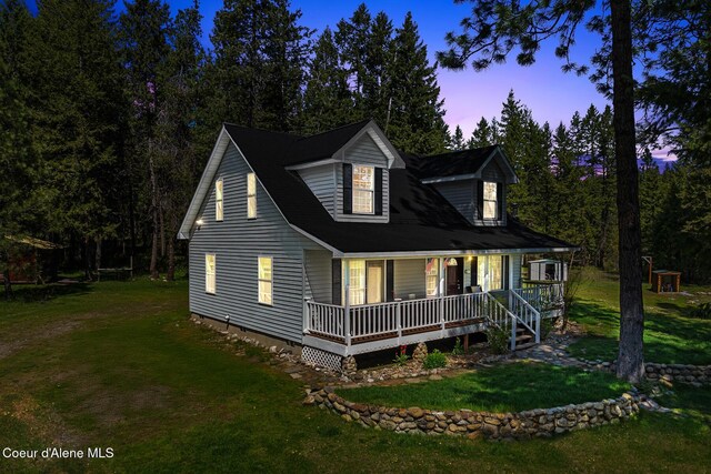 130 Stone Haven Dr, Blanchard, ID 83804 - view of front of house with covered porch and a yard