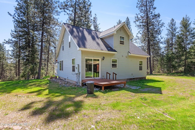 130 Stone Haven Dr, Blanchard, ID 83804 - rear view of property featuring a shingled roof, a yard, and a deck