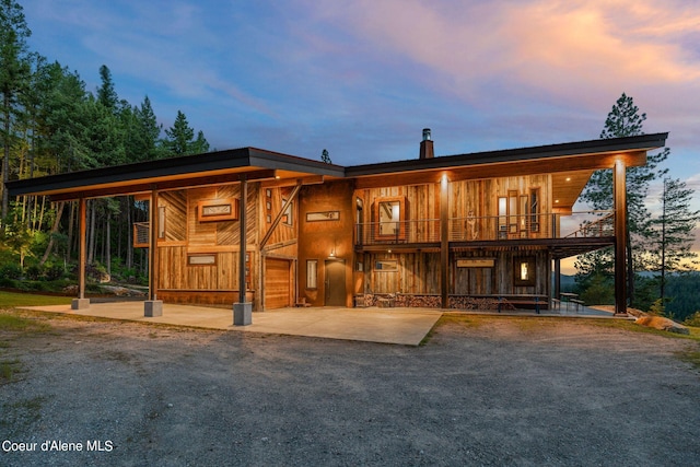 172 Elk Hills Rd, Sandpoint, ID 83864 - view of front of home featuring a balcony and a chimney