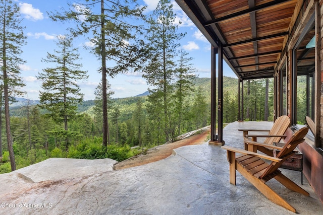 172 Elk Hills Rd, Sandpoint, ID 83864 - view of patio featuring a wooded view