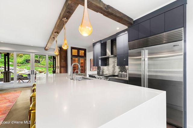 172 Elk Hills Rd, Sandpoint, ID 83864 - kitchen featuring built in refrigerator, wall chimney exhaust hood, beam ceiling, french doors, and a sink