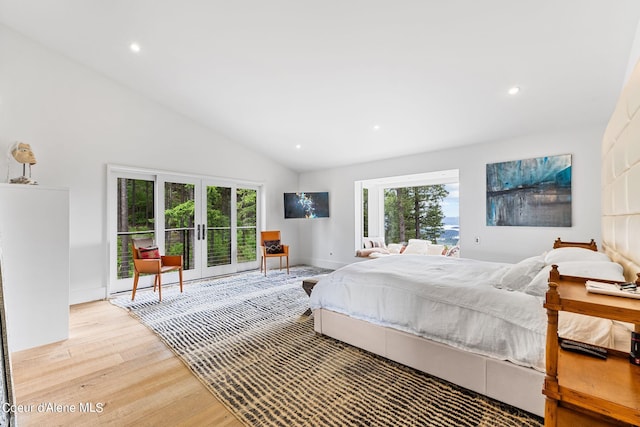 172 Elk Hills Rd, Sandpoint, ID 83864 - bedroom featuring french doors, light wood-style flooring, access to outside, recessed lighting, and high vaulted ceiling