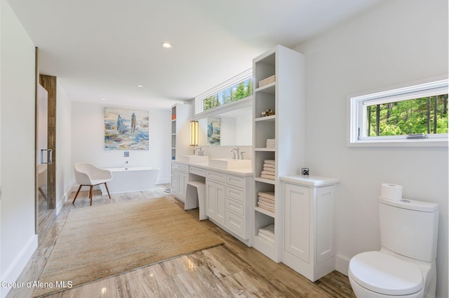 172 Elk Hills Rd, Sandpoint, ID 83864 - full bathroom featuring vanity, healthy amount of natural light, a soaking tub, toilet, and recessed lighting