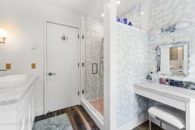 172 Elk Hills Rd, Sandpoint, ID 83864 - bathroom with wood finished floors, vanity, a shower stall, and recessed lighting