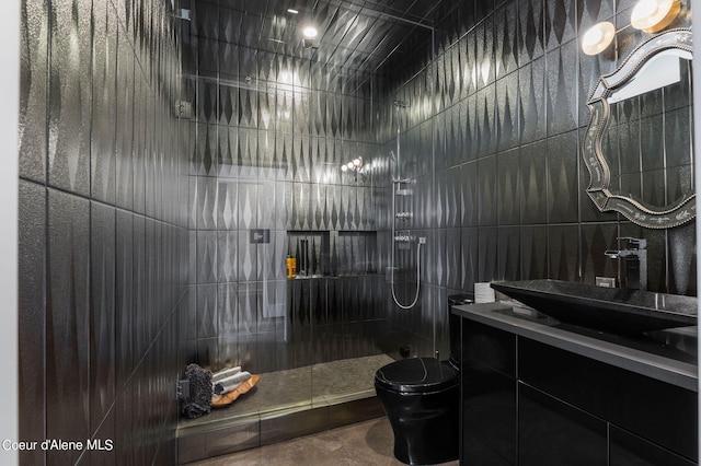 172 Elk Hills Rd, Sandpoint, ID 83864 - full bath featuring tiled shower, toilet, vanity, and concrete flooring